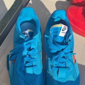 Nike Blue Sneakers with Red Accents